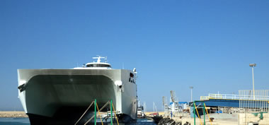 Stage of docking at the port of the catamaran